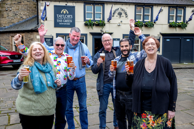Members of the Airedale Quiz League enjoying a pint outside Taylor's on the Green, Keighley.